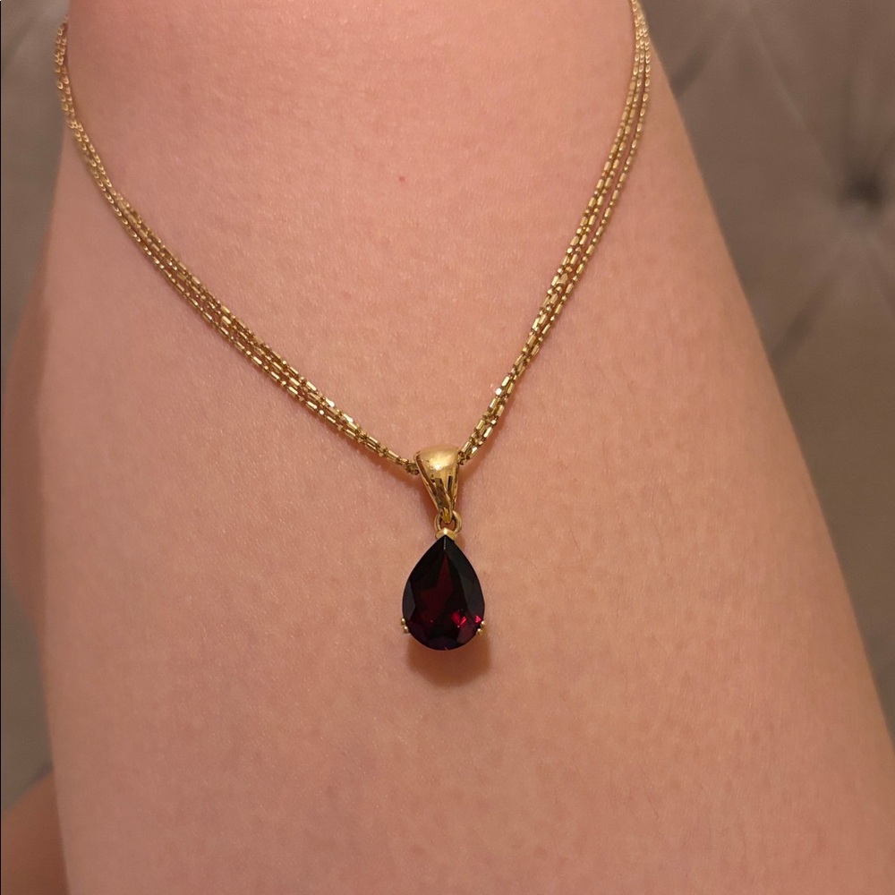 Elegant Gold Necklace with Red Teardrop Pendant